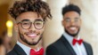 © Trushchenko_O - Two men wearing suits and red bow ties are smiling for the camera