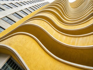 Poster - Architectural Photography of Soft Waves in Yellow Gradient with Smooth Curves, Capturing Fluidity and Elegance in Modern Design, Perfect for Contemporary Spaces and Aesthetic Inspirations