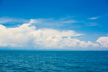 Wall Mural - Deep blue sea ocean sunny sky with cloud nature landscape