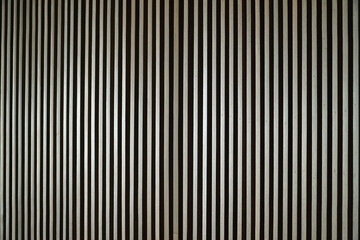 Poster - Close-up view of a wall featuring vertical wooden slats, creating an abstract pattern of light and shadow. Abstract Vertical Lines.. A Study in Light and Shadow on Steel Slats.