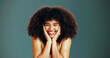 © peopleimages.com - Portrait, beauty and excited woman with afro hair care, studio and treatment for wellness and health. Face, growth and happy model with smile, volume and natural texture on green background in Brazil