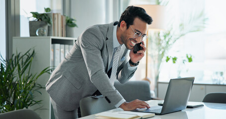 Canvas Print - Business, man and phone call with laptop in office for communication, planning schedule and happy news. Smile, male person and mobile for discussion, reading email and negotiation feedback of project