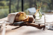 © 24K-Production - Glamping hut restaurant with fresh bread on table in forest.