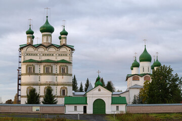 Wall Mural - At the entrance to the old Nikolo-Vyazhischsky monastery on a cloudy October morning. Neighborhood of Veliky Novgorod, Russia