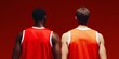 © Ryzhkov - Back View of Two Basketball Players in Red Jerseys Against Solid Background