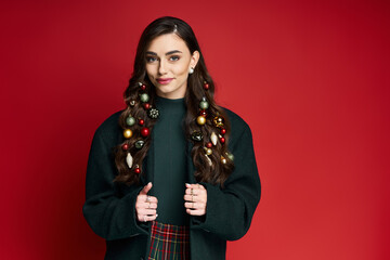 Wall Mural - Joyful young woman showcases holiday spirit with ornaments in her hair and a warm smile.