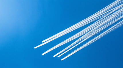Aufkleber - Four bright white lines drawn confidently across a clear blue background, ideal for technology and design.

