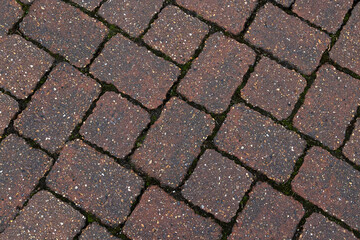 Poster - Red block paving stones in closeup background