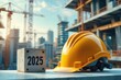 © JuLady_studio - Construction industry 2025: construction helmet, 2025 on grey brick and cityscape background with sunlit cranes