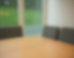 Poster - A blurred wall with a green landscape and glass window is in focus while the wood table blurs into the background._00001_