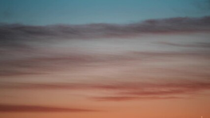 Wall Mural - Real Colorful Evening Sunset Sky Stars. Natural Starry Sky Background Backdrop. Time Lapse Star Sky. Orange Blue Dark Night Timelapse. Star Trails On Evening Sky
