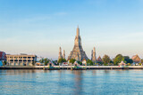 Beautiful of Buddhist temple or Wat Arun Ratchawararam Ratchawaramahawihan with famous tourist landmark sunlight in the morning, Bangkok, Thailand.