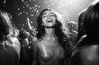 Excited young woman dancing at a festive party with falling confetti