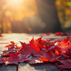Poster - Autumn background scene with red maple leaves on table with sunlight. Natural seasonal home decor for fall season, thanksgiving, halloween and holiday showroom.