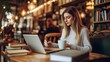 © mirifadapt - novelist writing in a minimalist coffee shop, with a laptop open and books, coffee cups, and warm light creating a cozy ambiance