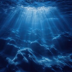 Wall Mural - Underwater scene of a deep blue ocean with sunlight shining through the water