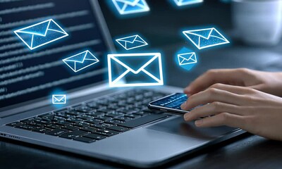 Poster - Engaging in email management using a smartphone and laptop in a modern workspace with digital notifications appearing around