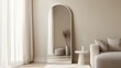 © azi - Full-length arched mirror in minimalist living room.