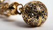 © Aino Minako - A gold and silver ball with a gold chain hanging from it