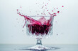 © romanets_v - Red liquid splashing in crystal glass