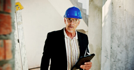 Poster - Construction site, portrait and man with tablet, engineering and network with connection. Mature person, architecture and employee with hard hat, technology and safety with digital app or real estate