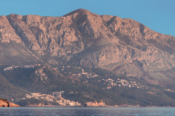 Wall Mural - Scenic view of mountains meeting the sea in Montenegro, creating a tranquil and picturesque landscape