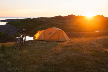 tent in the shine of the midnight sun in iceland