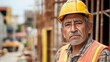 © liliyabatyrova - An aged Hispanic worker stands confidently at a bustling construction site, showcasing his resilience and dedication. The urban backdrop illuminates the effort behind city development