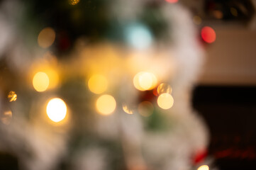 Wall Mural - bokeh lights on a Christmas tree holiday background