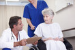 © peopleimages.com - Feedback, doctor or old woman in wheelchair in hospital talking to elderly patient for results. Medical, diagnosis or healthcare worker in clinic consulting senior person with disability or clipboard