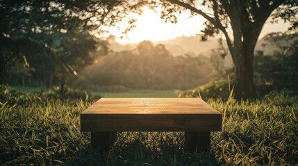 Aufkleber - Amidst the vibrant green grass, a sturdy wooden podium rests peacefully, illuminated by the golden light of the setting sun, creating a tranquil atmosphere in nature's embrace