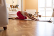 © ADDICTIVE STOCK - Woman Practicing Yoga at Home with Abundance of Natural Light