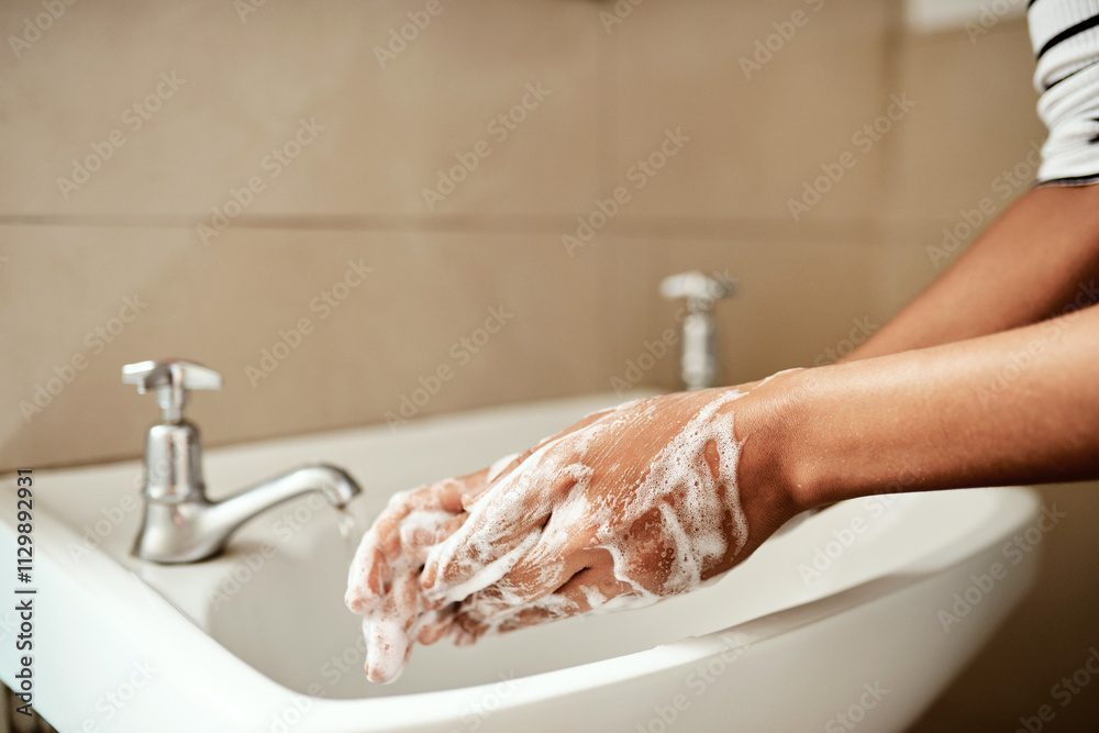 Hands, person and washing hands in bathroom on sink with soap for ...
