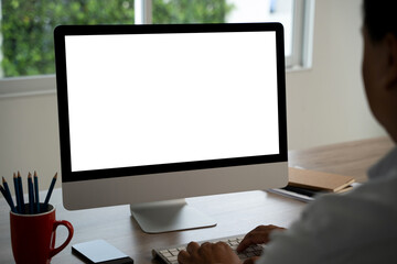 Fototapete - man working Businessman using a desktop computer of the blank screen with hands