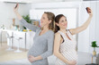 © auremar - pregnant women taking selfie with mobile