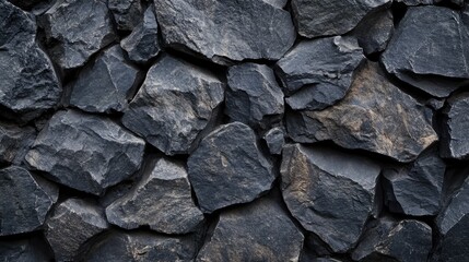 Poster - Dark gray natural stone texture wallpaper featuring a rugged black stone surface with a striking interplay of light and shadow.