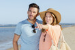 © auremar - young couple pointing the beach
