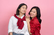 © PBXStudio - Cute girl in red shirt and jeans and her friend in stylish outfits with smiles.