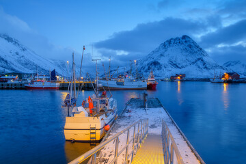 Wall Mural - fishing boats in the bay. lofoten islands, norway. winter landscape on the north. photo for backgrou