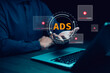 © Bussarin - Ads text on laptop display screen from advertisers on internet. Ads banner campaign to target.digital marketing concept.online rich media native targeting advertising marketing strategy.
