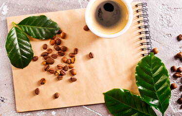 Poster - black coffee in coffee cup with coffee bean and on stone table