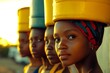 © Archibalttttt - Young african women carrying buckets on their heads at sunset
