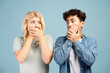 © Maria Vitkovska - Scared, young boyfriend and girlfriend covering mouth with hands, looking each other