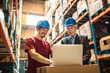 © Davor - Warehouse worker and manager discussing inventory with a laptop