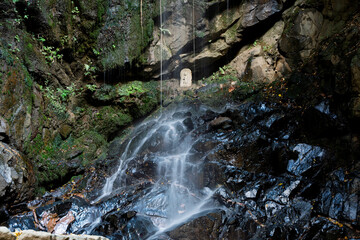 Wall Mural - Waterfall deep in the mountains, mysterious scenery	
