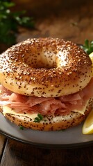 Sticker - A toasted bagel sandwich filled with ham and cheese, garnished with parsley and lemon.