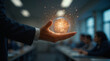 © Iombi - Hombre sosteniendo esfera luminosa en contexto empresarial