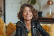 © Markus Schröder - Portrait of a joyful woman in her 50s sporting a classic leather jacket on crisp minimalistic living room