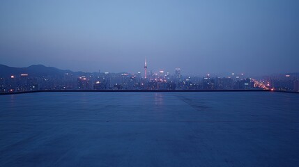 Poster - A serene cityscape at dusk, showcasing urban lights and distant mountains.