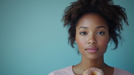 Poster - A woman holding a donut in front of her face